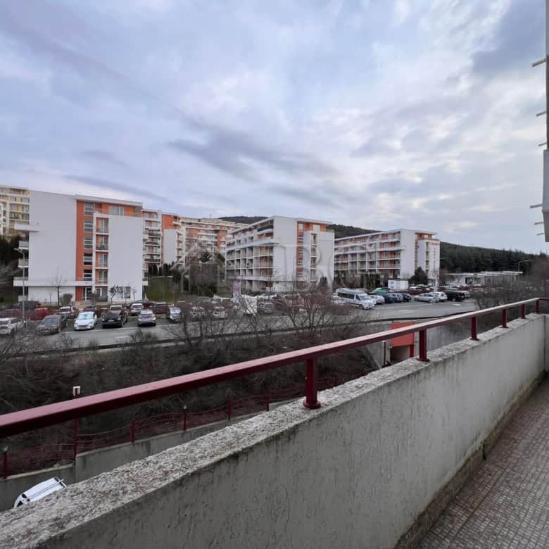 Bright balcony overlooking Sveti Vlas marina and surrounding residential buildings.