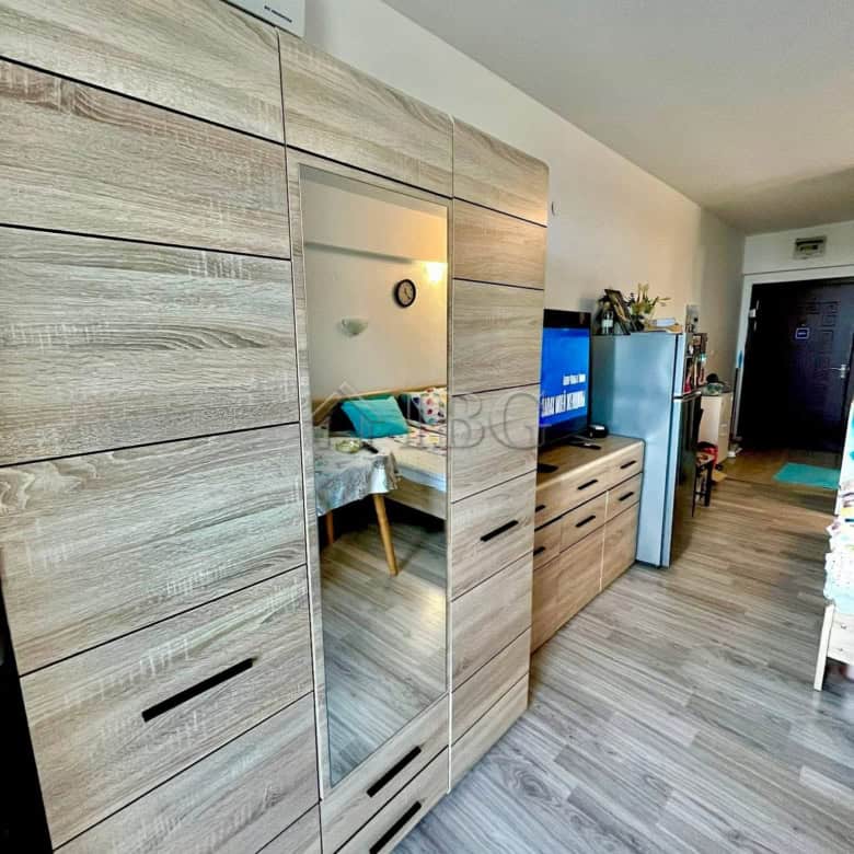 Modern studio apartment with balcony, low maintenance fee, and stylish furnishings in Ravda.