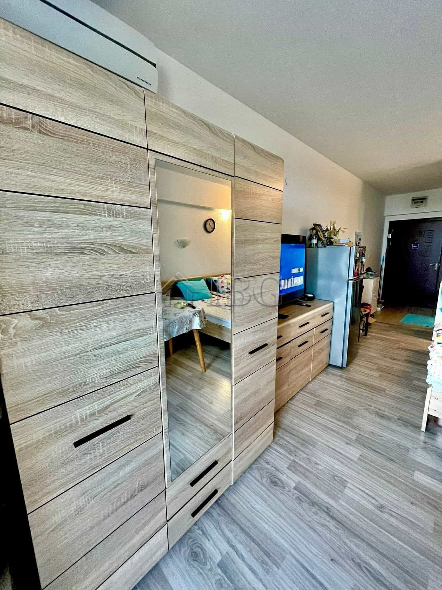 Modern studio apartment with balcony, low maintenance fee, and stylish furnishings in Ravda.