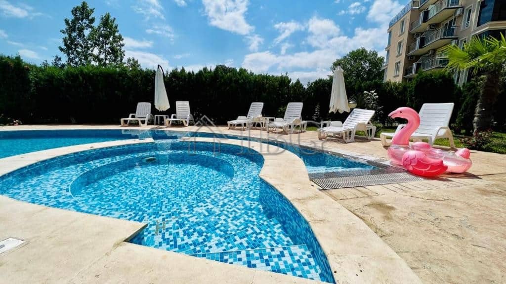 Pool area with sun loungers and umbrellas at VIP Zone Complex, Sunny Beach.