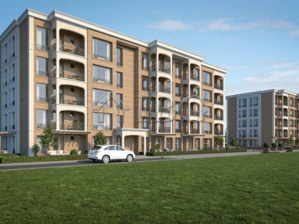 Modern residential building in Nessebar with spacious balconies and green surroundings.