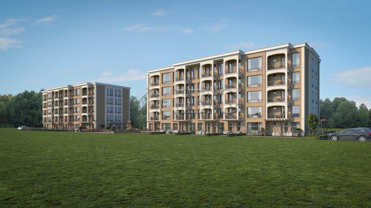 Modern residential complex in Nessebar with spacious balconies and green surroundings.