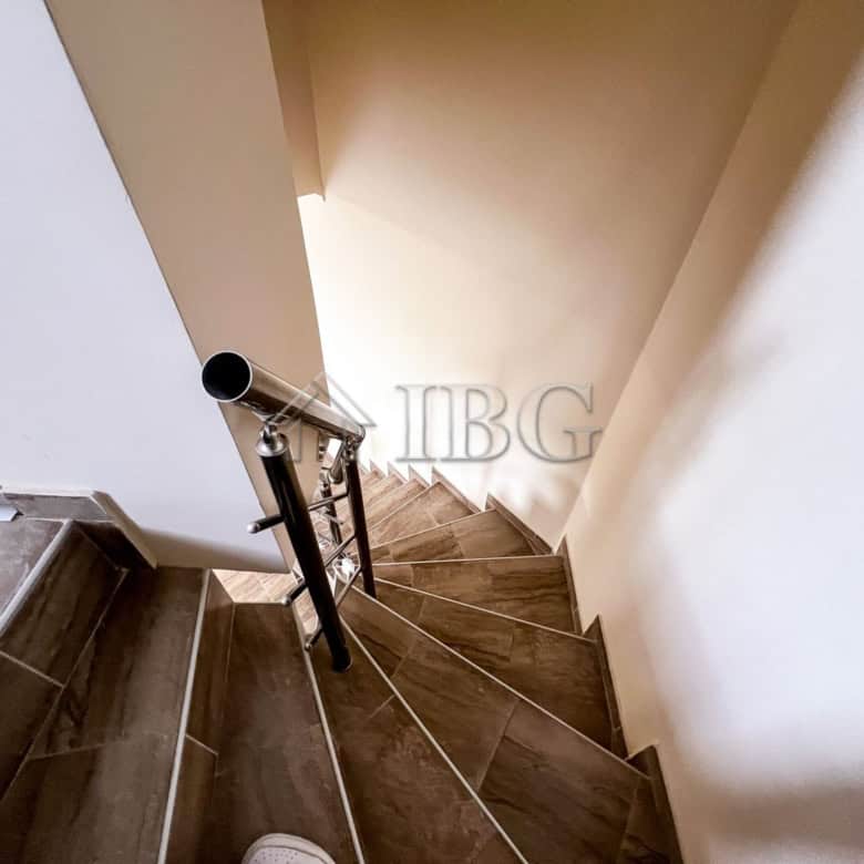 Bright staircase in a duplex apartment with pool view in Sunny Beach.