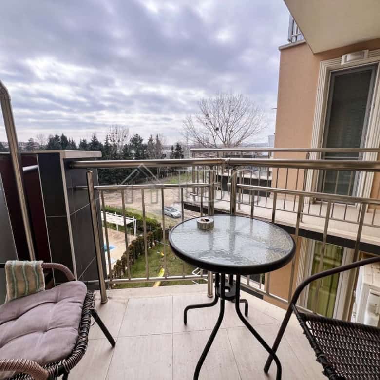 Balcony view of pool and surrounding area in Sunny Beach apartment.