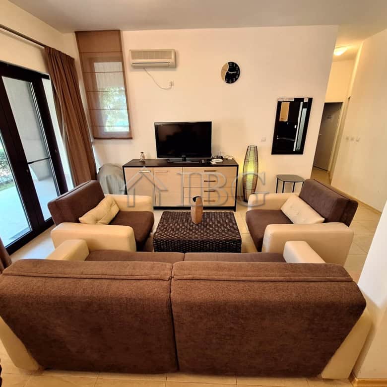 Bright living room with modern furniture and large windows overlooking the sea. Perfect beachfront p.