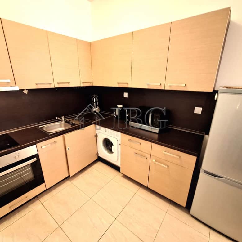 Bright kitchen with modern appliances and ample storage space.