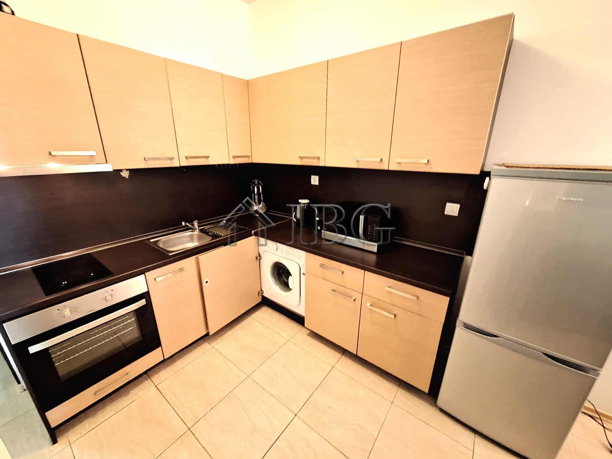 Bright kitchen with modern appliances and ample storage space.