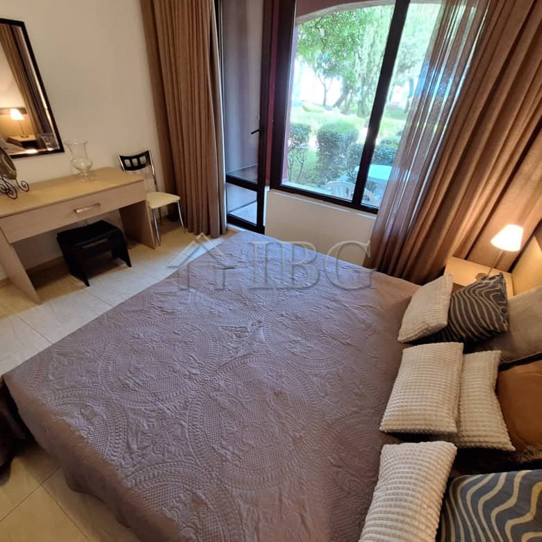 Spacious bedroom featuring a large window with garden and sea views, perfect for relaxing and enjoyi.