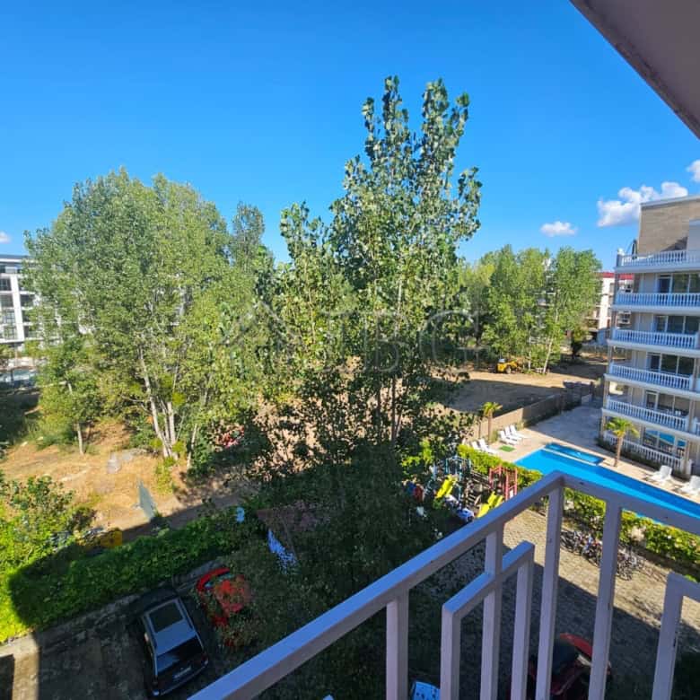 Bright 1-bedroom apartment with balcony overlooking lush greenery in Gerber 4 Residence, Sunny Beach.