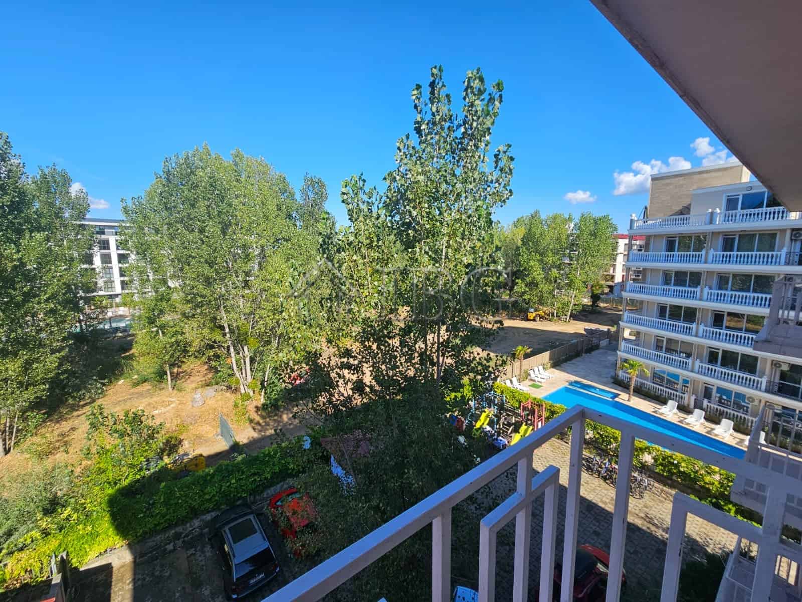 Bright 1-bedroom apartment with balcony overlooking lush greenery in Gerber 4 Residence, Sunny Beach.