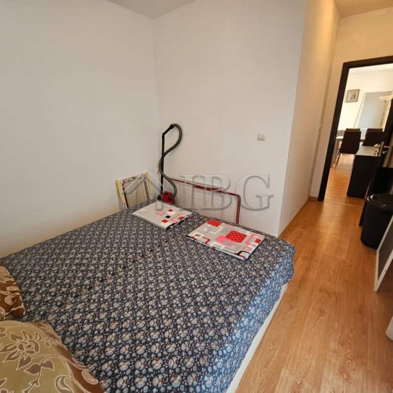 Bright bedroom with double bed and modern decor in Sunny Beach.
