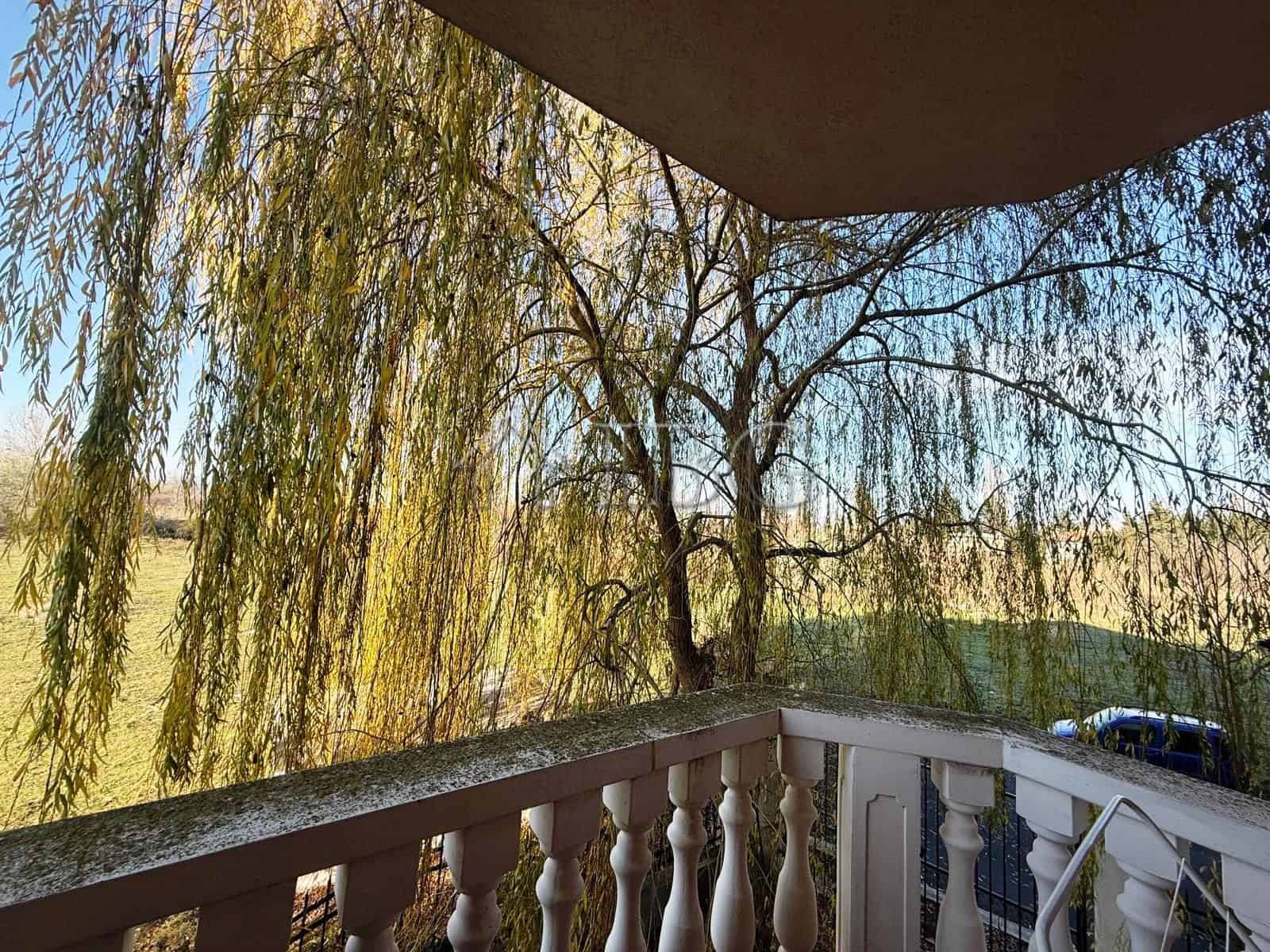 Balcony view of trees and river from Sea Diamond apartment in Sunny Beach.