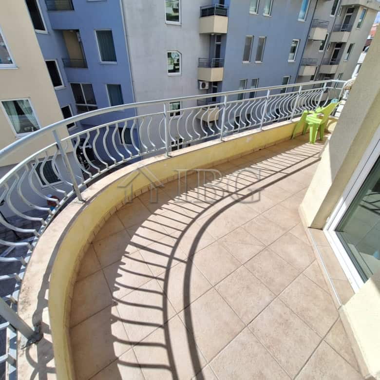 Balcony of a 2-bedroom apartment overlooking the pool at Breeze complex, Sunny Beach.