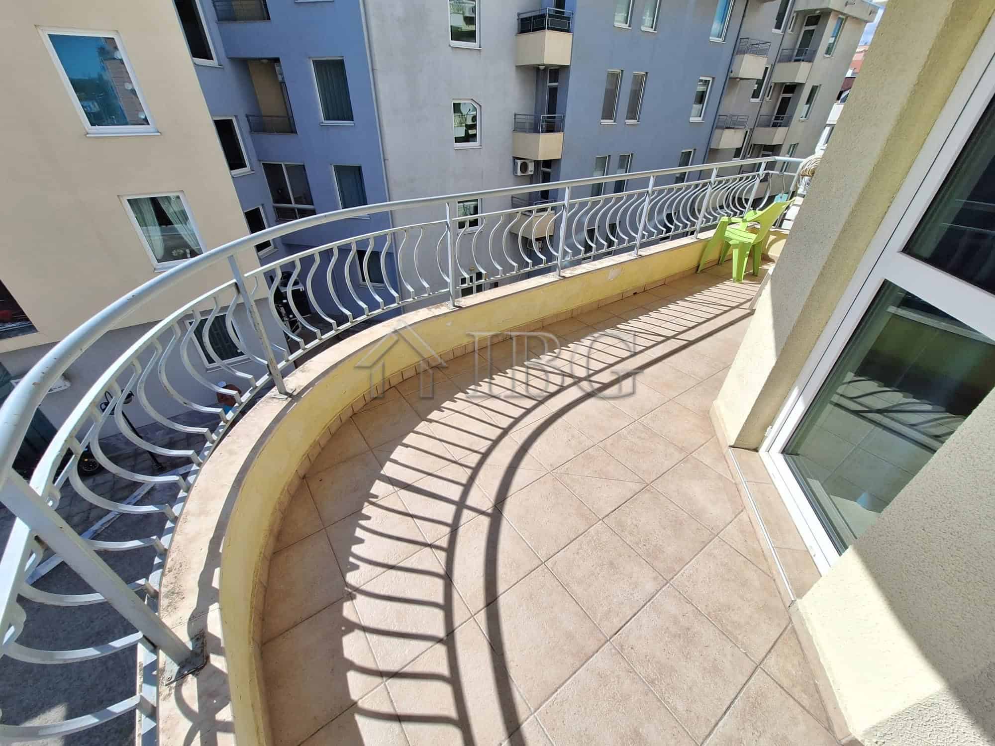 Balcony of a 2-bedroom apartment overlooking the pool at Breeze complex, Sunny Beach.