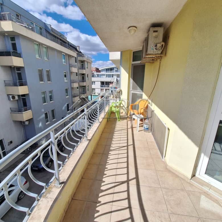 Balcony of a 2-bedroom apartment overlooking the pool at Breeze complex, Sunny Beach.