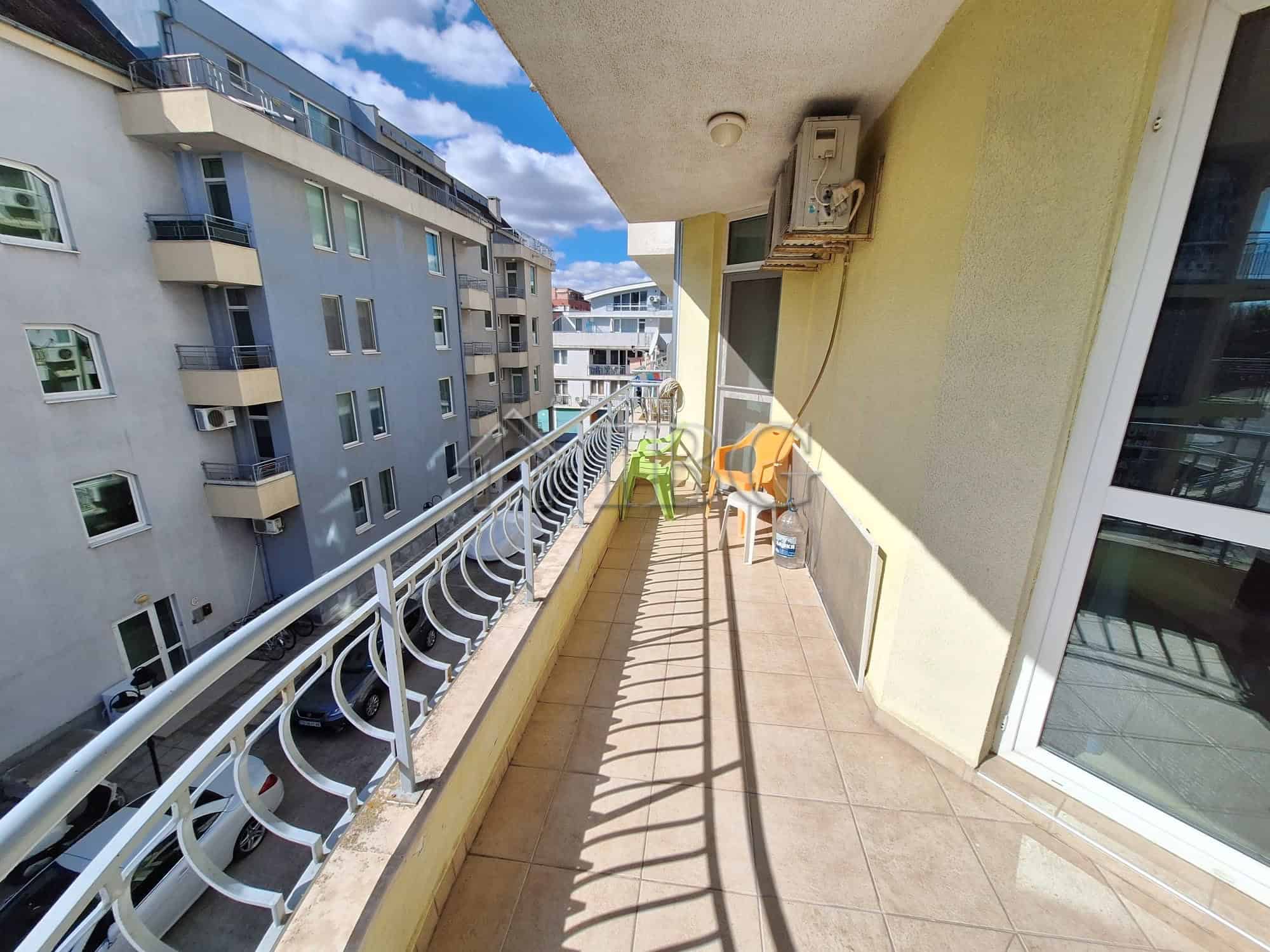 Balcony of a 2-bedroom apartment overlooking the pool at Breeze complex, Sunny Beach.