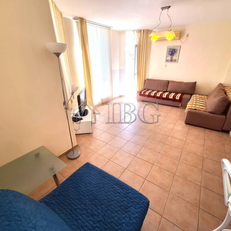 Bright living room with pool view in Breeze complex, Sunny Beach.