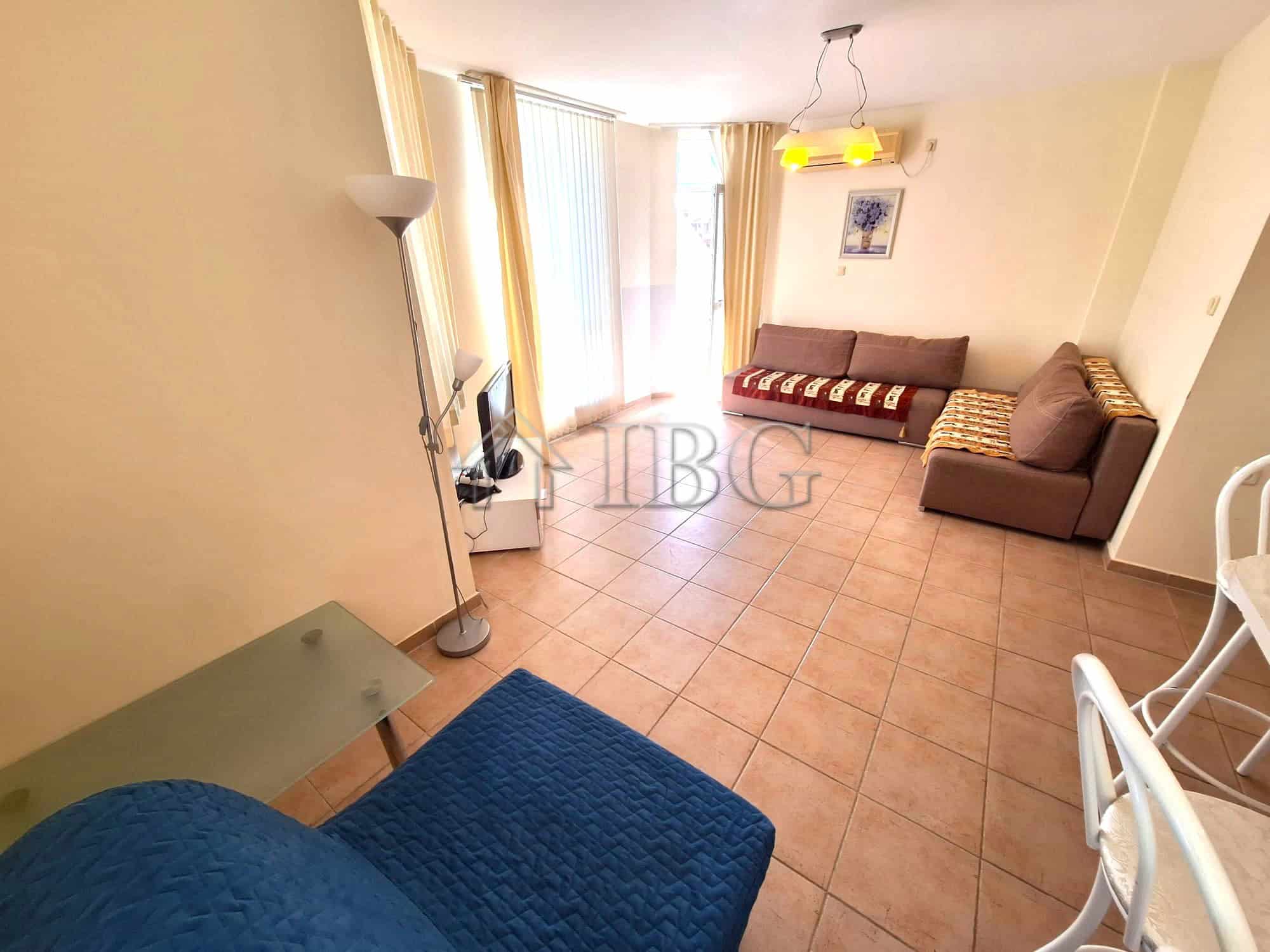Bright living room with pool view in Breeze complex, Sunny Beach.