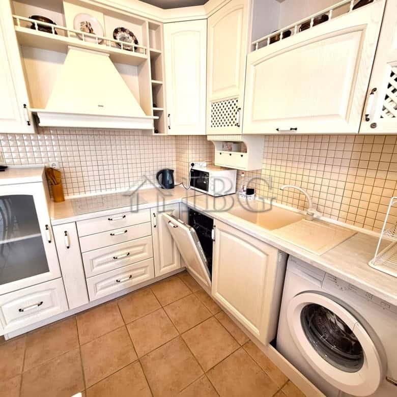 Bright kitchen in a modern apartment with pool view in Breeze complex, Sunny Beach.