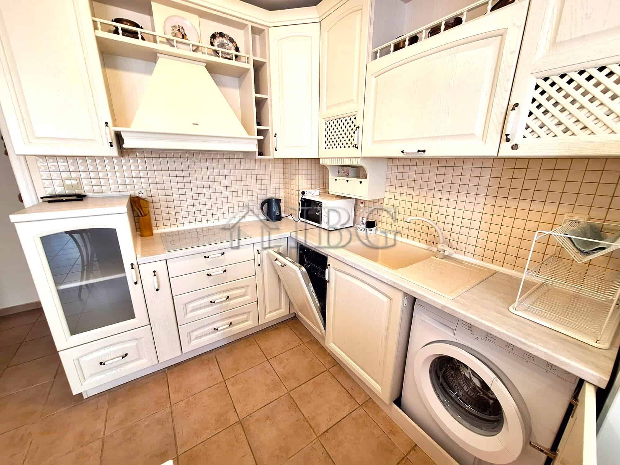 Bright kitchen in a modern apartment with pool view in Breeze complex, Sunny Beach.