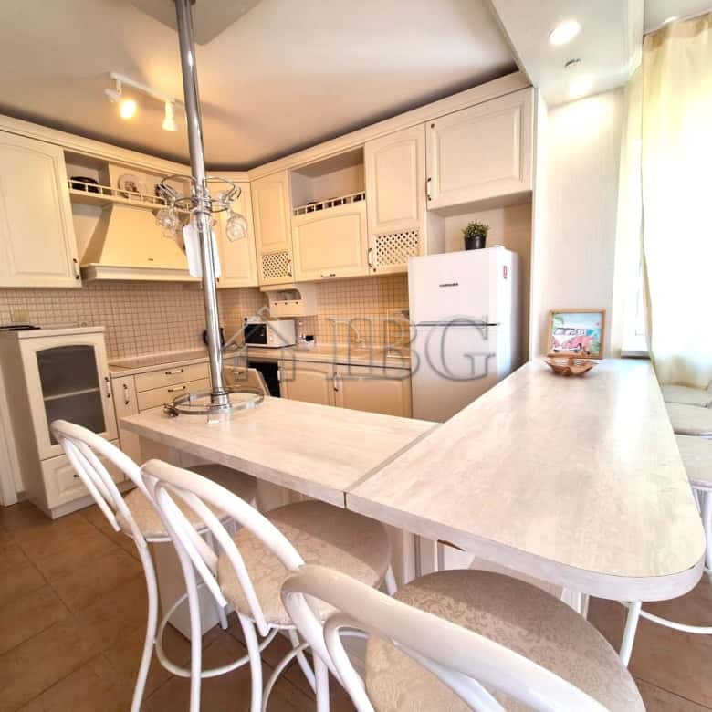 Spacious 2-bedroom apartment featuring a pool view, modern kitchen, and bright living space in Breez.