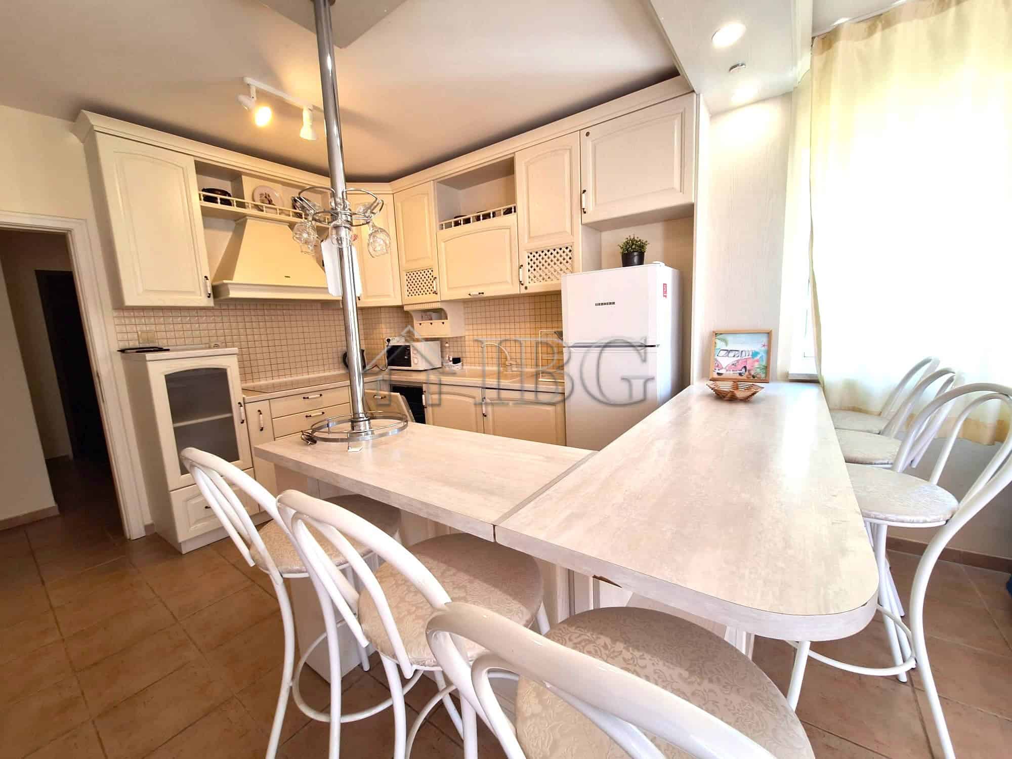 Spacious 2-bedroom apartment featuring a pool view, modern kitchen, and bright living space in Breez.