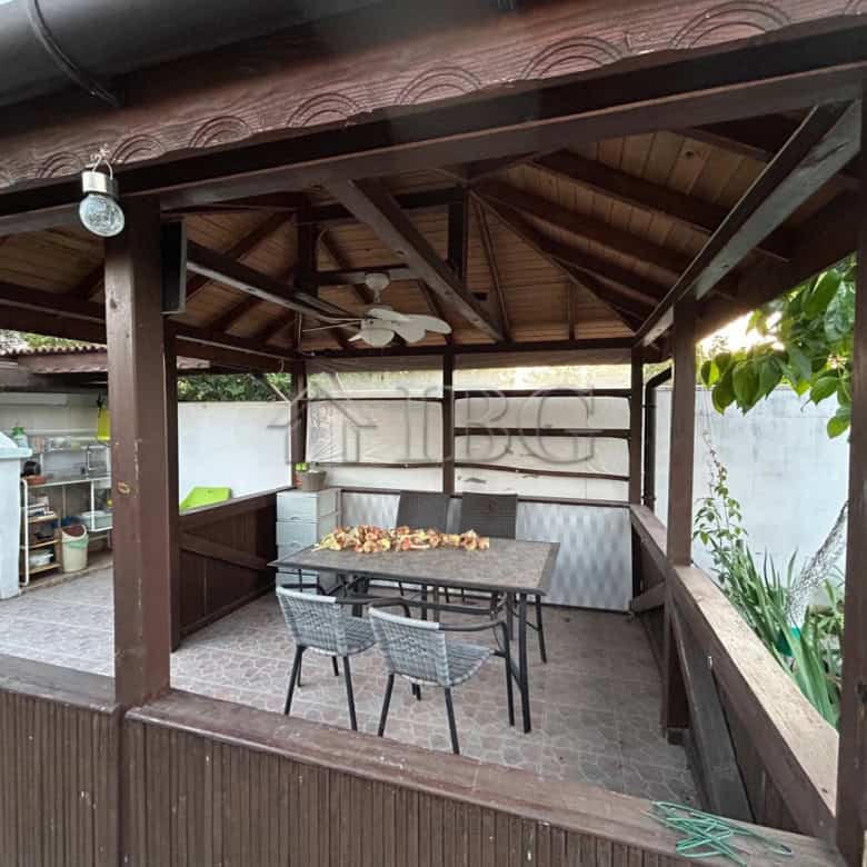 Outdoor dining space with seating in a renovated house near the sea in Kamenar district.
