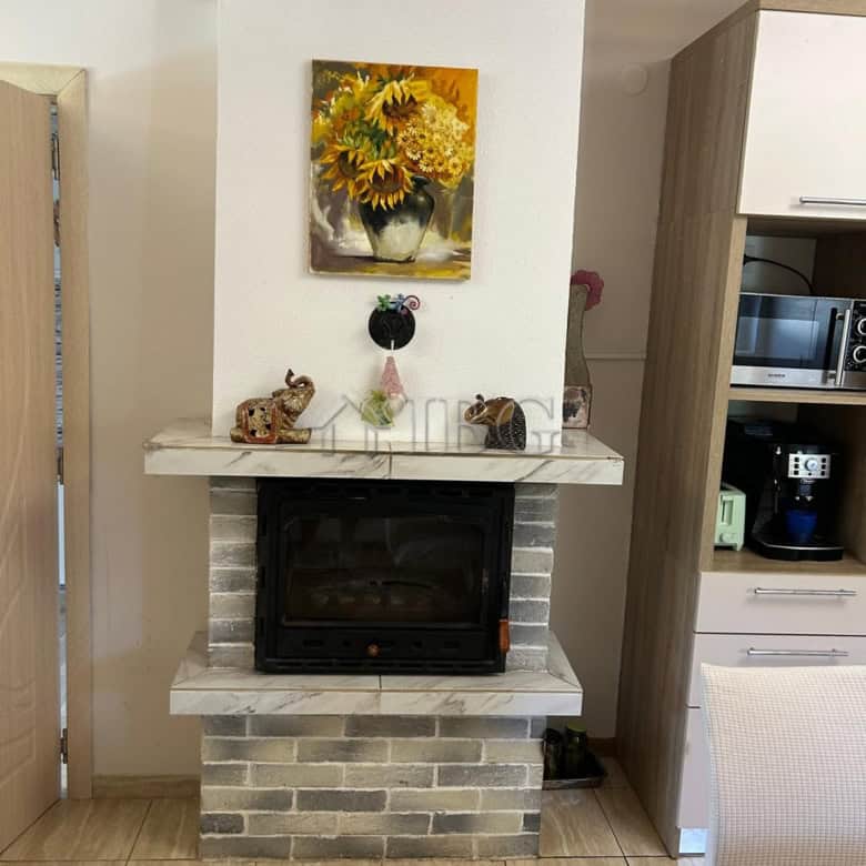 Charming fireplace in a renovated 3-bedroom house near the sea in Kamenar, Pomorie, decorated with f.