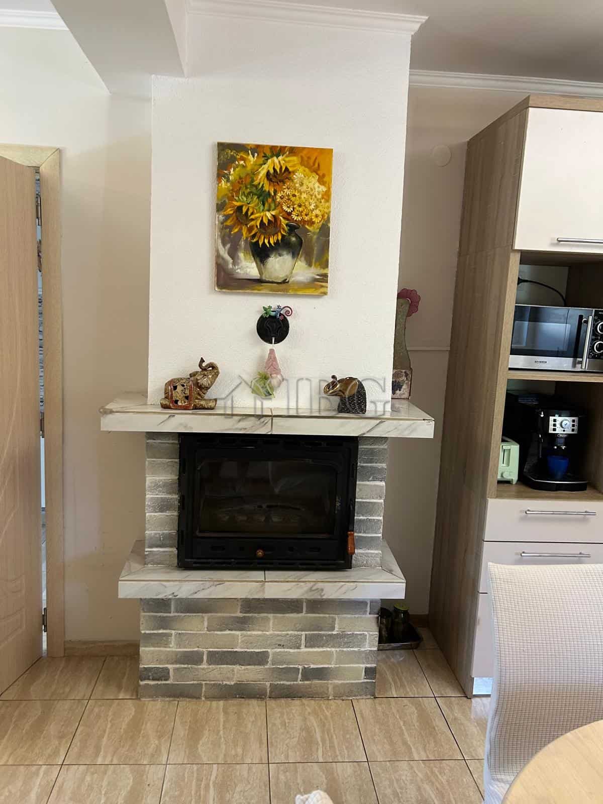 Charming fireplace in a renovated 3-bedroom house near the sea in Kamenar, Pomorie, decorated with f.