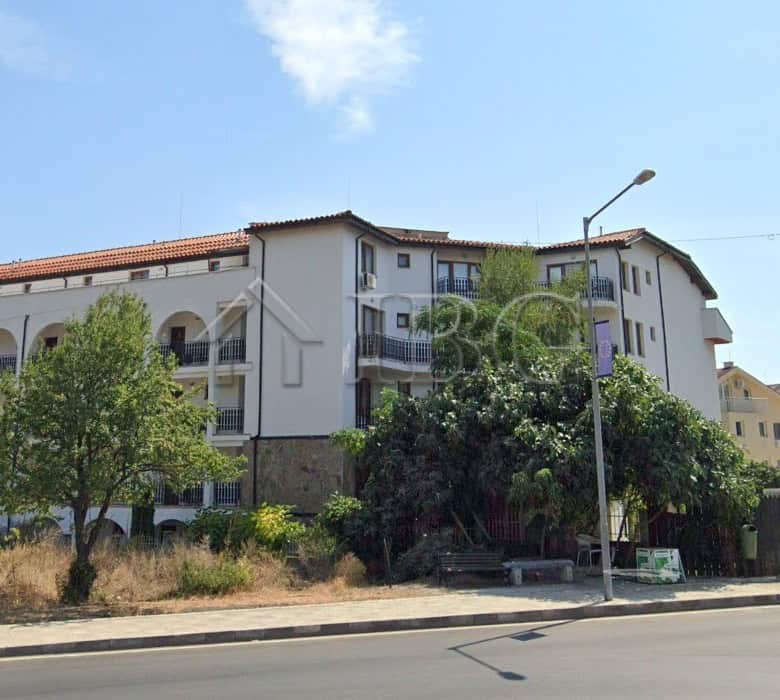 Apartment building with balconies and white exterior in Ravda Sun & Sea Resort.