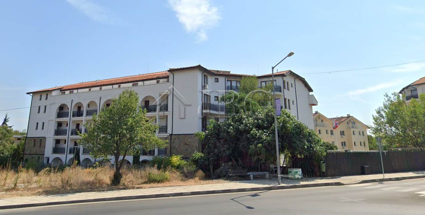 Apartment building with balconies and white exterior in Ravda Sun & Sea Resort.