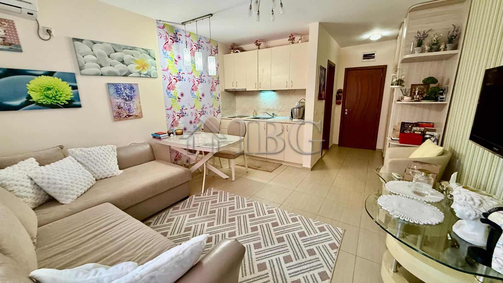 Bright living room in a 2-bedroom apartment near the beach in Nessebar. Modern decor, cozy seating,.