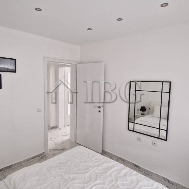 Bright apartment interior with large terrace overlooking the sea.