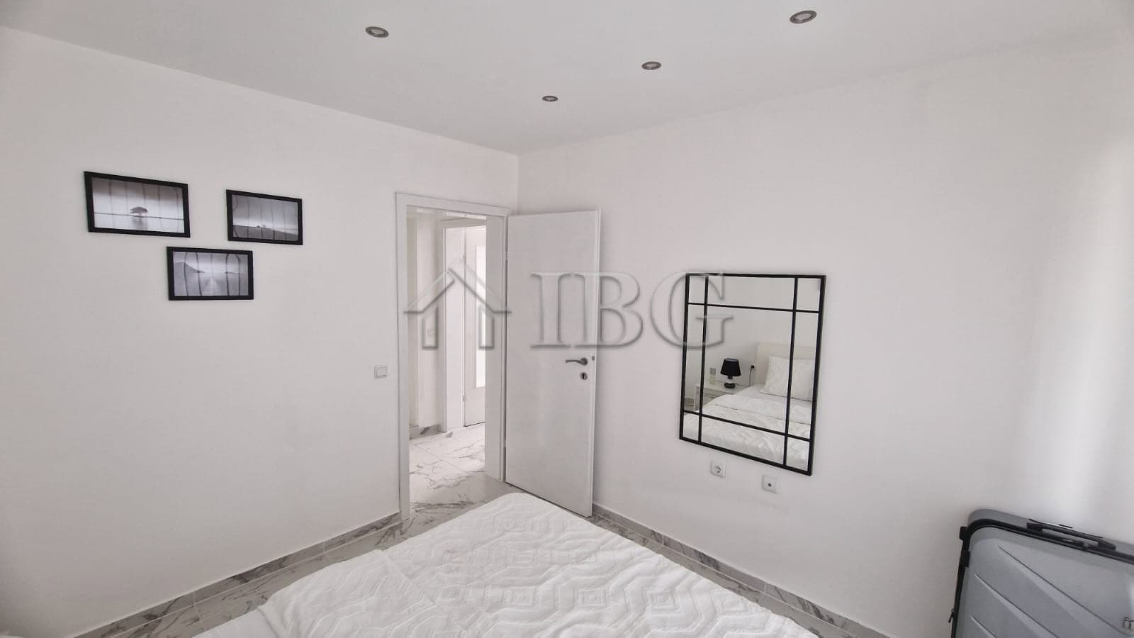 Bright apartment interior with large terrace overlooking the sea.