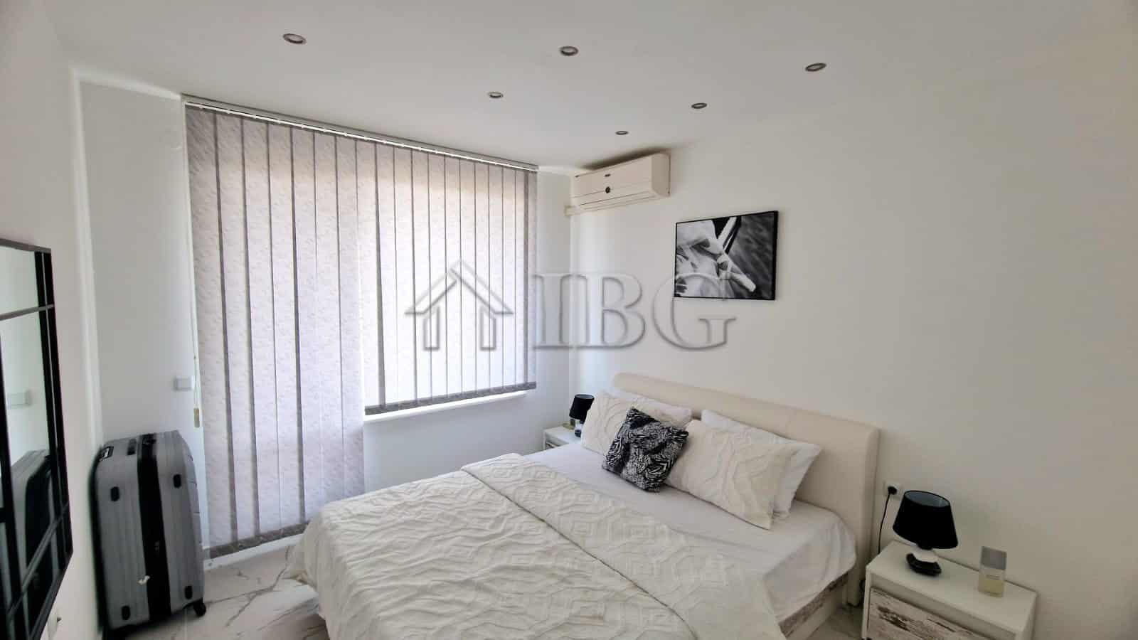 Bright bedroom with sea view, large terrace, and modern decor in Sveti Vlas apartment.