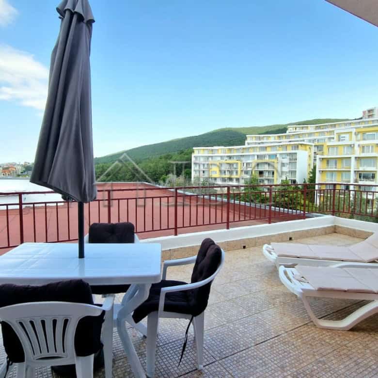 Sea view from renovated apartment with large terrace and outdoor furniture. Perfect for relaxing and.