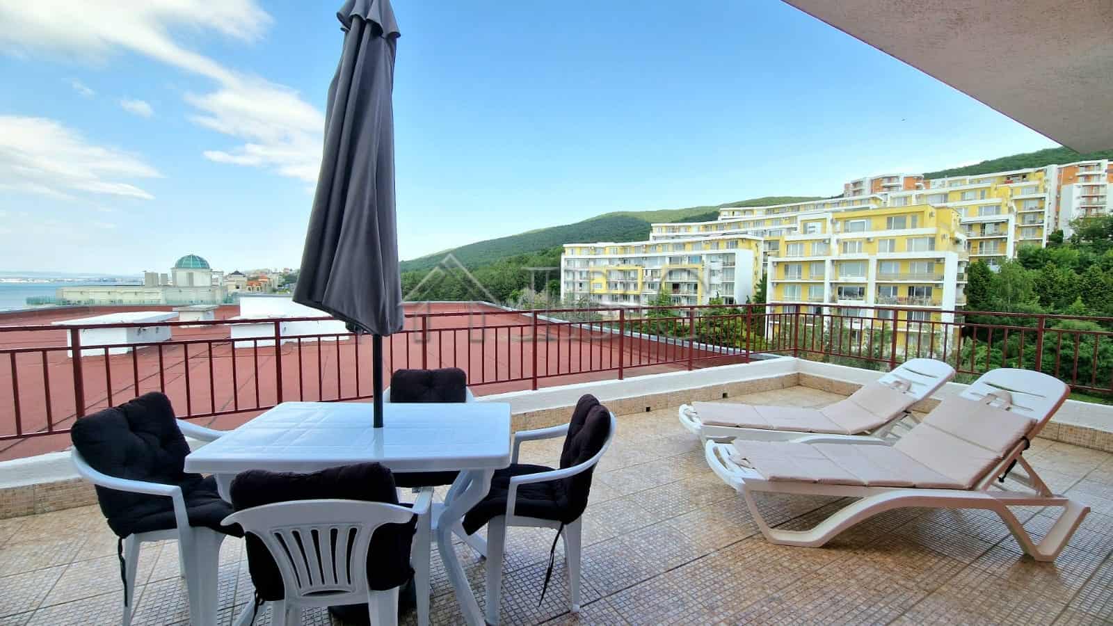 Sea view from renovated apartment with large terrace and outdoor furniture. Perfect for relaxing and.