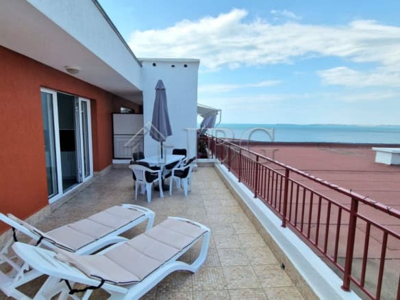 Sea view terrace of renovated apartment in Sveti Vlas with outdoor furniture and panoramic ocean sce.