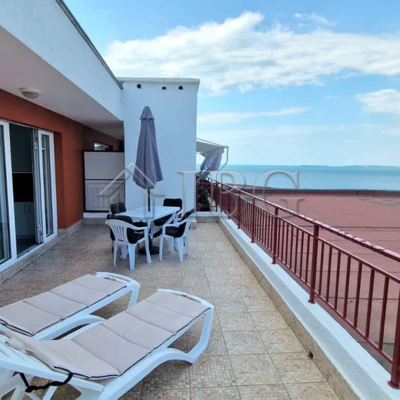 Sea view terrace of renovated apartment in Sveti Vlas with outdoor furniture and panoramic ocean sce.