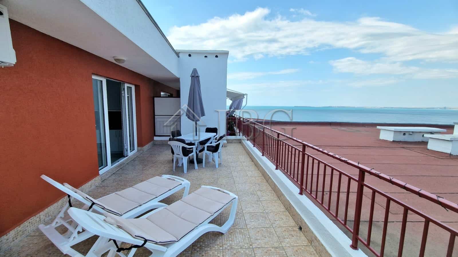 Sea view terrace of renovated apartment in Sveti Vlas with outdoor furniture and panoramic ocean sce.