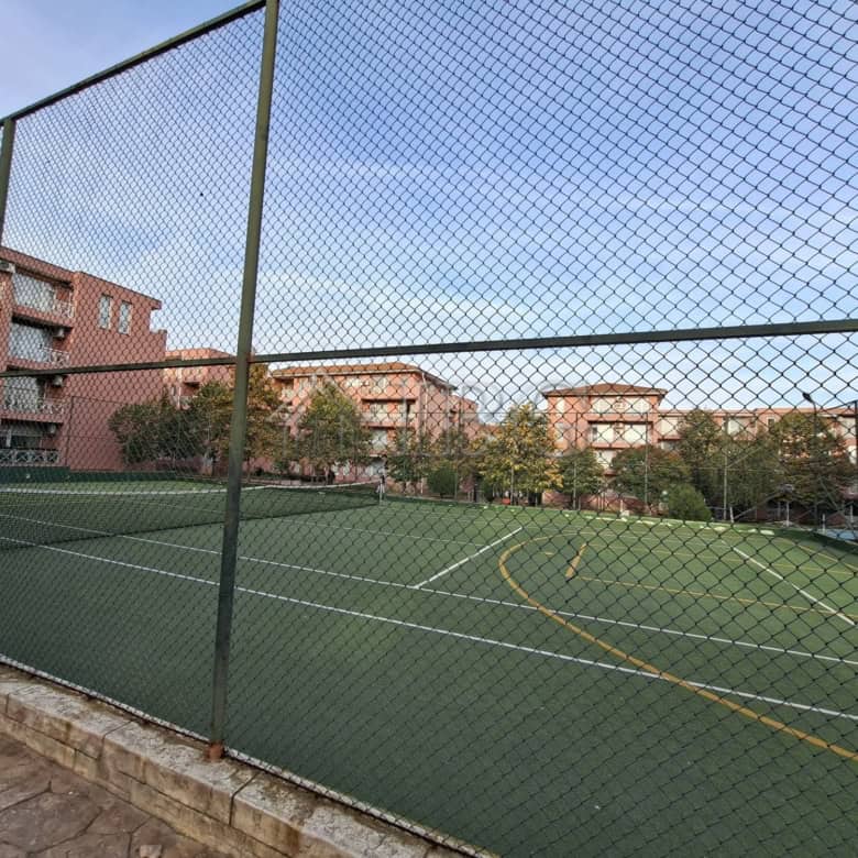 Furnished studio apartment with tennis court view in Sunny Beach on a sunny day.