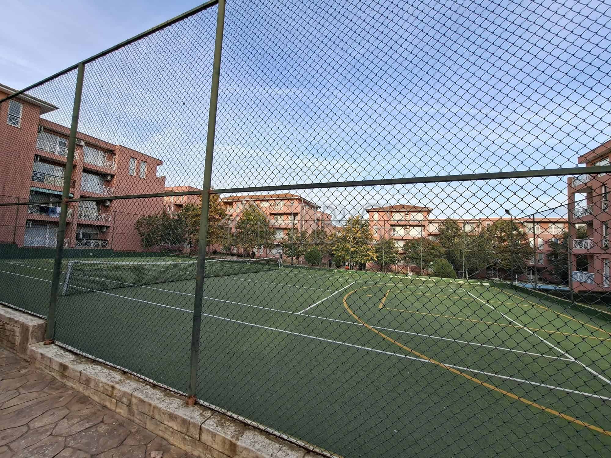 Furnished studio apartment with tennis court view in Sunny Beach on a sunny day.