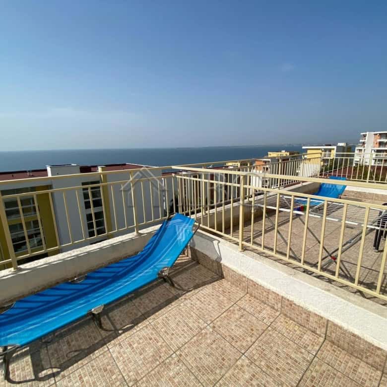 Sea view from the studio balcony overlooking the ocean and nearby resort buildings.