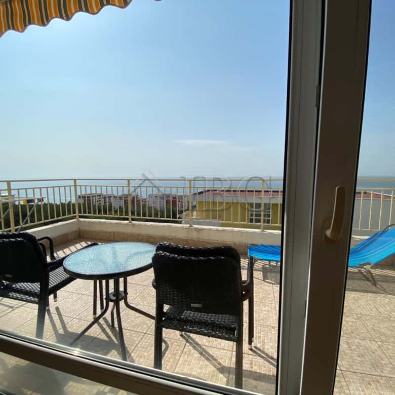 Sea View Studio with Balcony and Outdoor Seating.