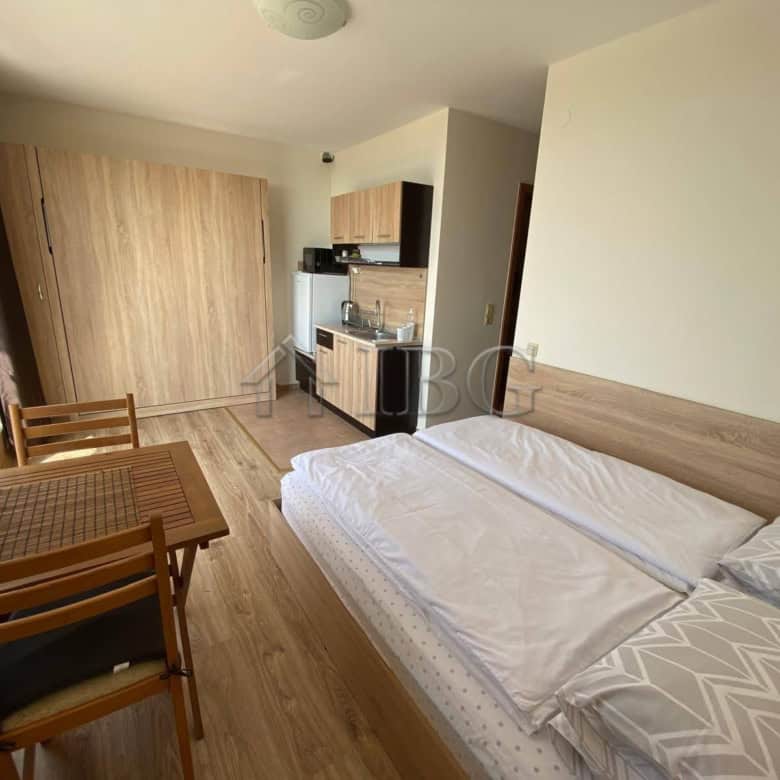 Sea view studio apartment at Crown Fort Club with modern furnishings and balcony access.