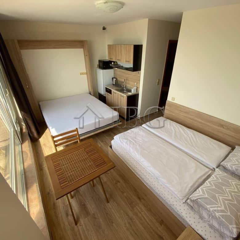 Cozy studio apartment with sea view, balcony, and modern amenities at Crown Fort Club.