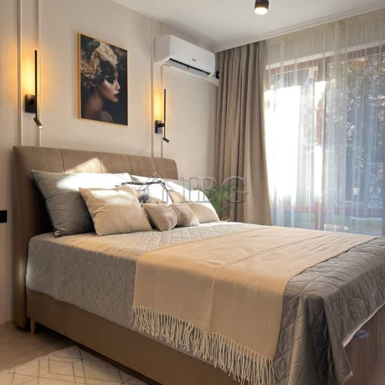 Cozy bedroom in Panorama Bay 2 with modern decor and natural light. Perfect for a relaxing stay in S.