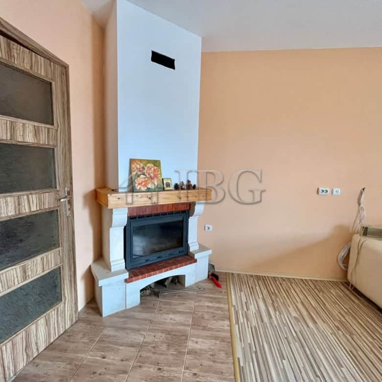 Spacious living room featuring a fireplace and modern decor in Goritsa Village.