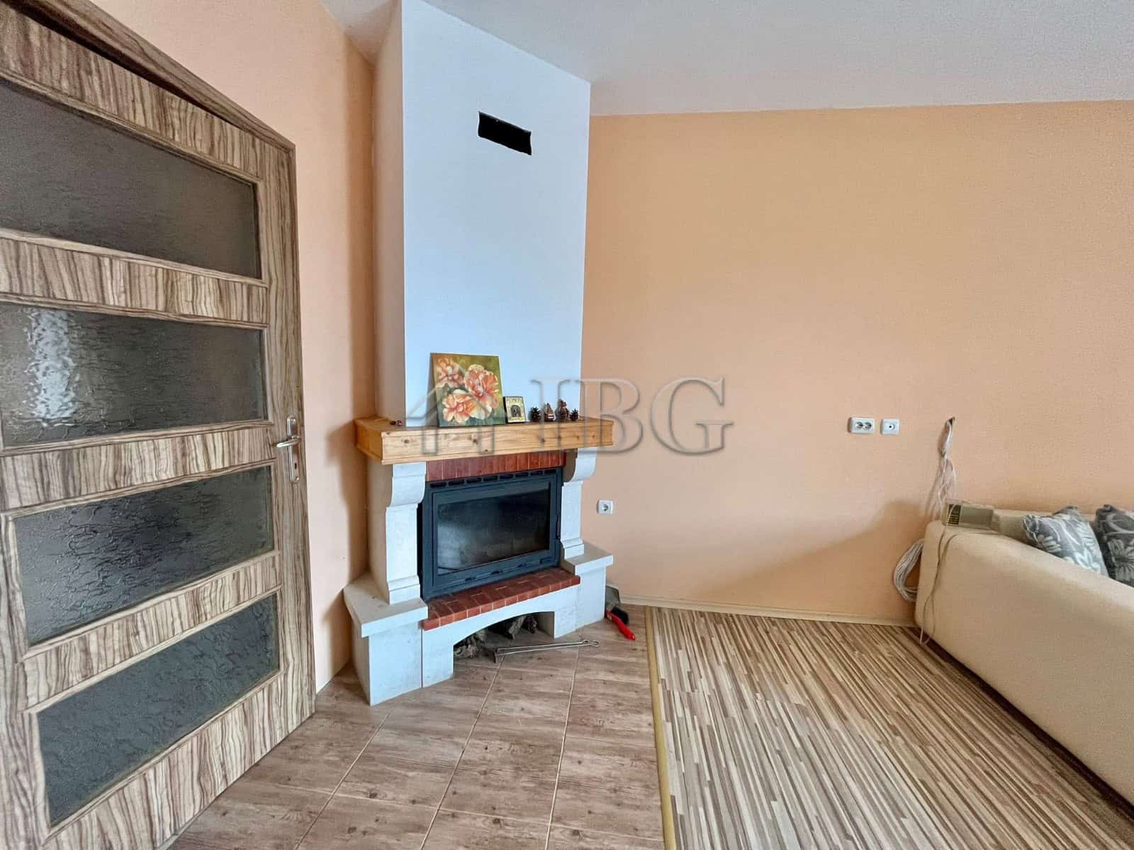 Spacious living room featuring a fireplace and modern decor in Goritsa Village.