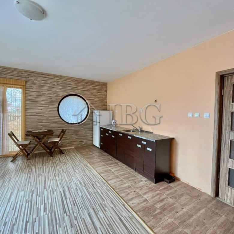 Interior view of a modern detached house with wooden flooring and stylish decor.